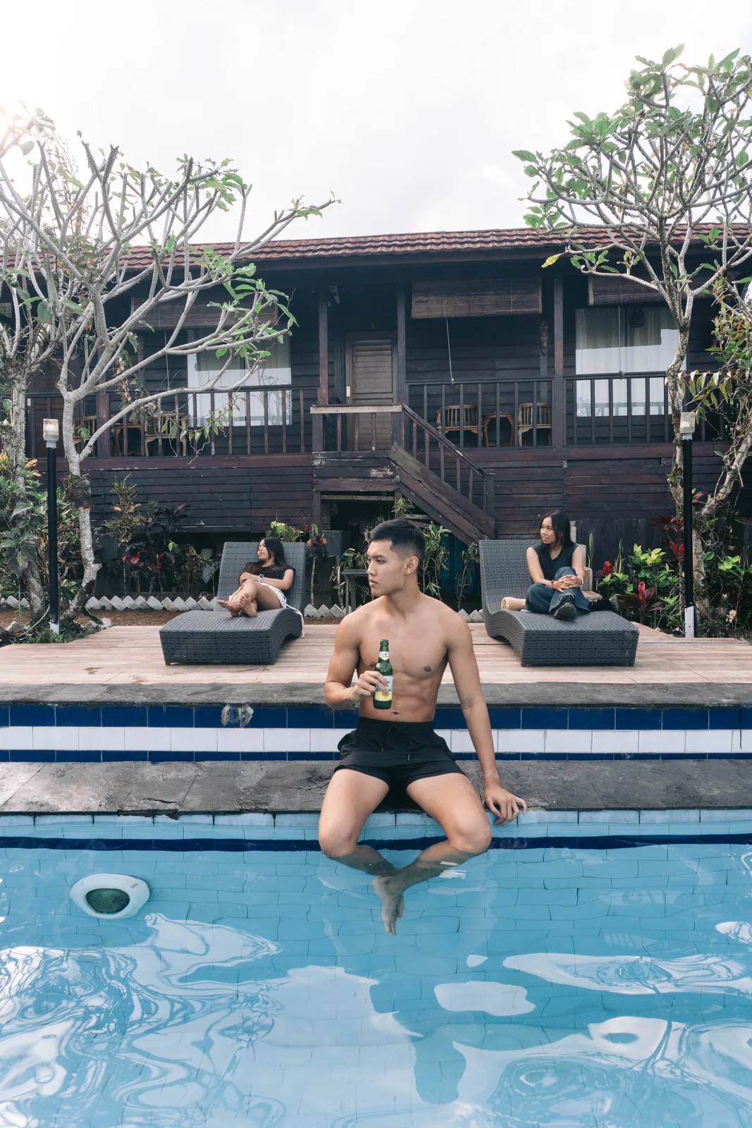 Sitting at the poolside edge